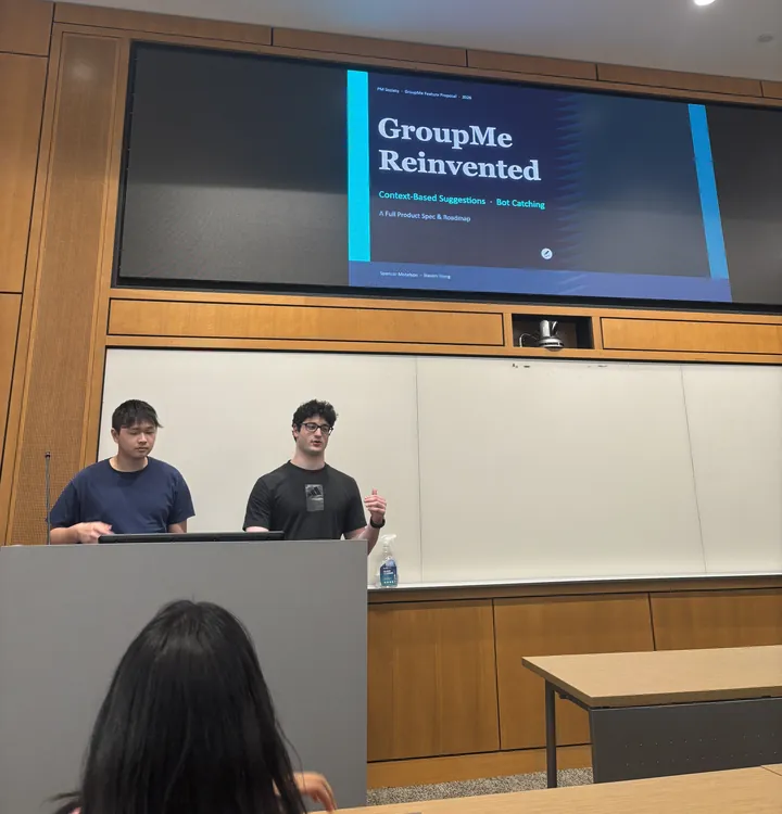 Two members pitching their product idea on stage